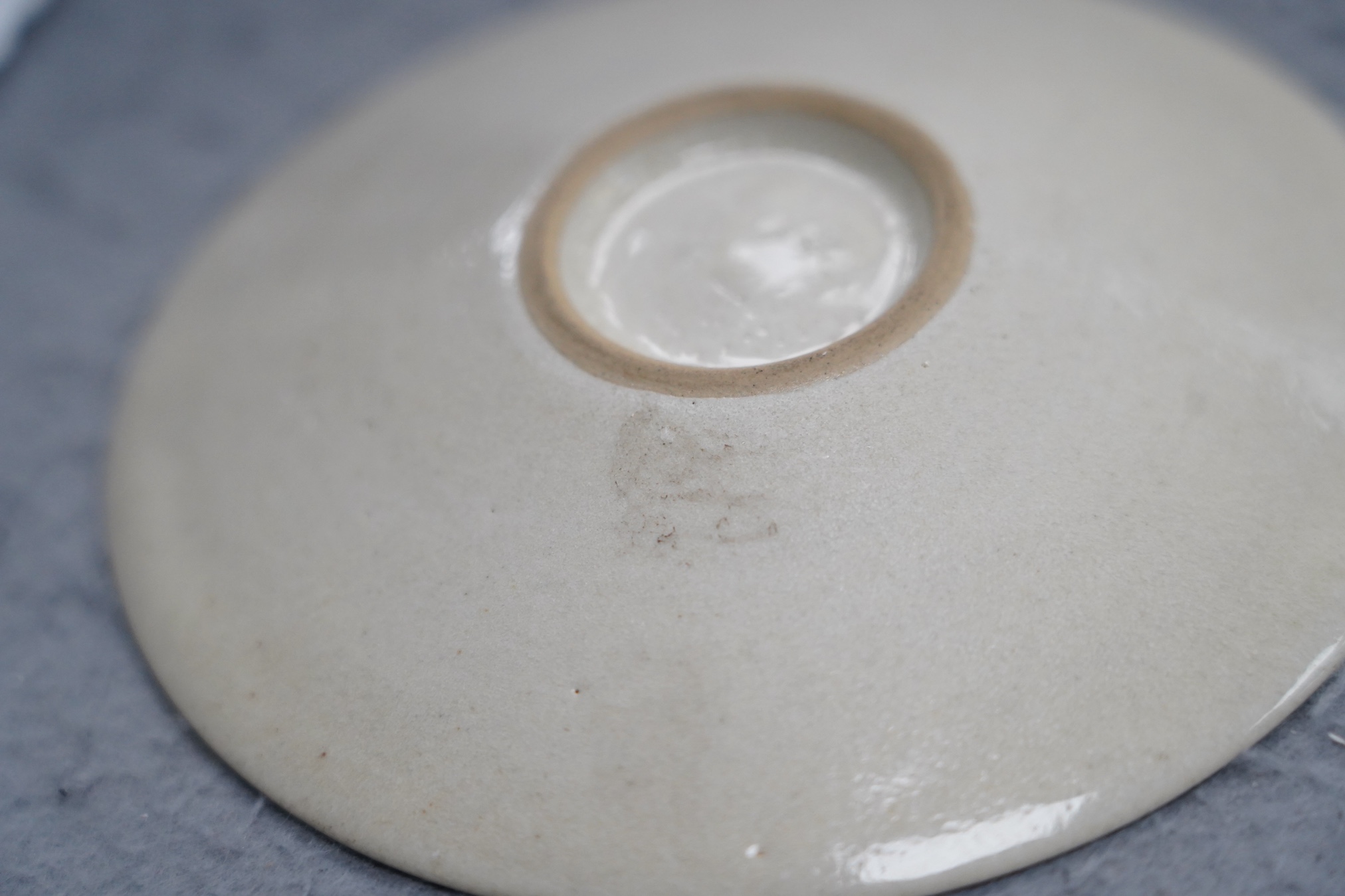 Dame Lucie Rie D.B.E. (1902-1995), a manganese glazed coffee cup and saucer